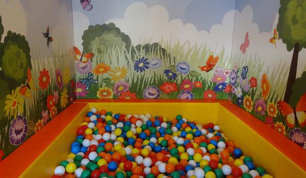 Softplay room with ball pool and wall decoration